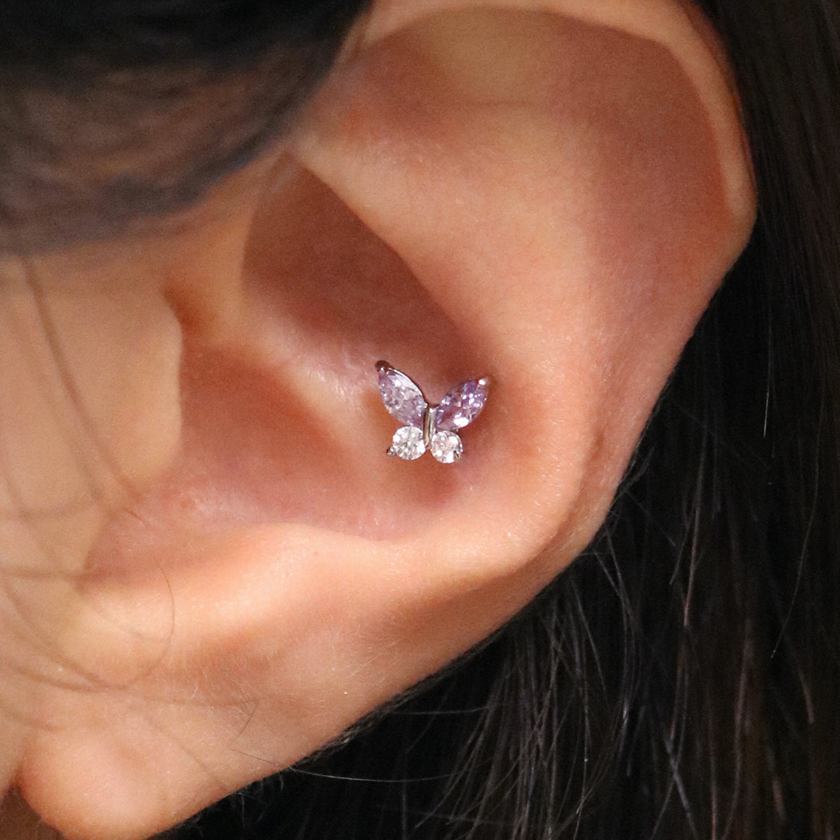 Purple butterfly piercing